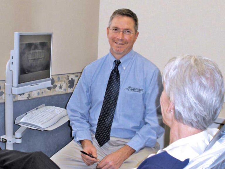 Dr. Kitzmiller with patient, chair-side monitor