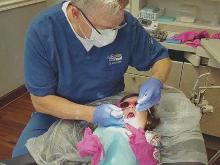 Dr. Kitzmiller with pediatric patient in Apex, NC Dr. Kitzmiller with pediatric patient in Apex, NC
